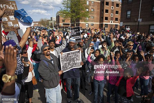 Thousands march through in front of the Baltimore Police Department's Western District police station to seek justice for the death for Freddie Gray...