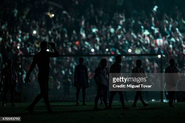 Players of Puebla and Chivas stand on the field during a blackout in the Championship match between Puebla and Chivas as part of Copa MX Clausura...