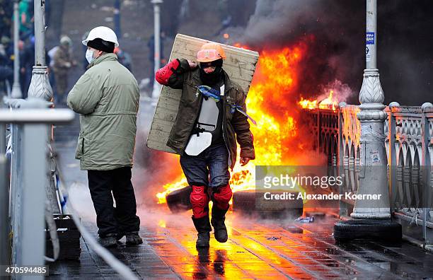 Anti-government protesters continue to clash with police in Independence square on February 20, 2014 in Kiev, Ukraine. Despite an overnight truce,...