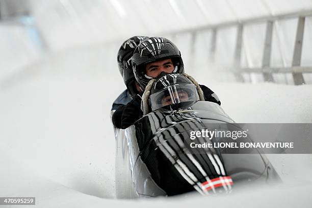 Austria-1 four-man bobsleigh, steered by Benjamin Maier, takes the brakes during a training session at the Sanki Sliding Center in Rosa Khutor during...