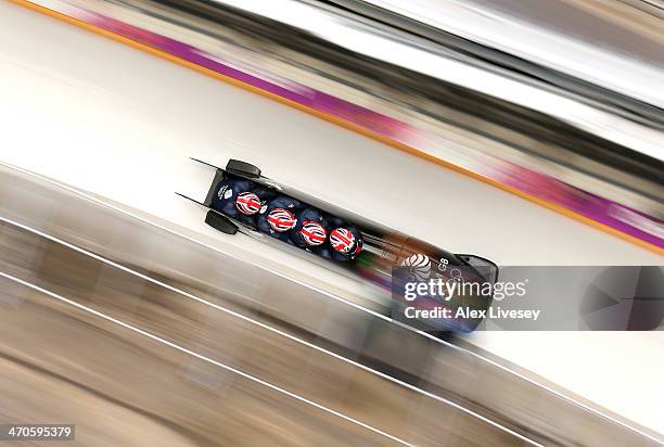 Lamin Deen of Great Britain pilots a run during a four-man bobsleigh practice session on Day 13 of the Sochi 2014 Winter Olympics at Sliding Center...