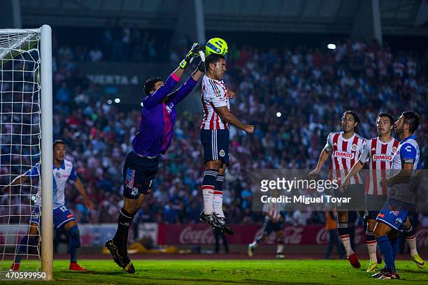 Fabian Villaseñor of Puebla fights for the ball with Marco Fabian of Chivas during a Championship match between Puebla and Chivas as part of Copa MX...