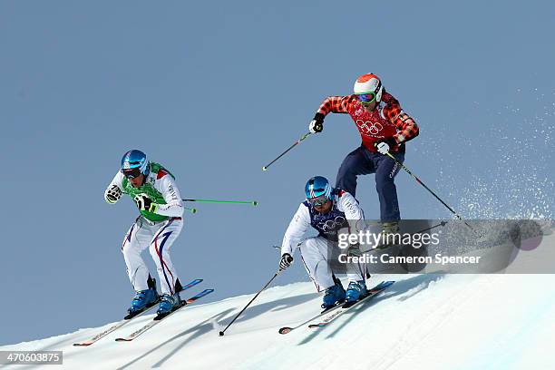 Gold medallist Jean Frederic Chapuis of France leads from silver medallist Arnaud Bovolenta of France and Brady Leman of Canada during the Freestyle...