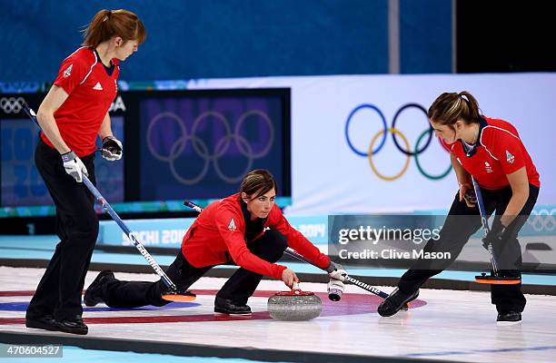 Eve Muirhead of Great Britain plays the final stone alongside Claire Hamilton and Vicki Adams during the Bronze medal match between Switzerland and...