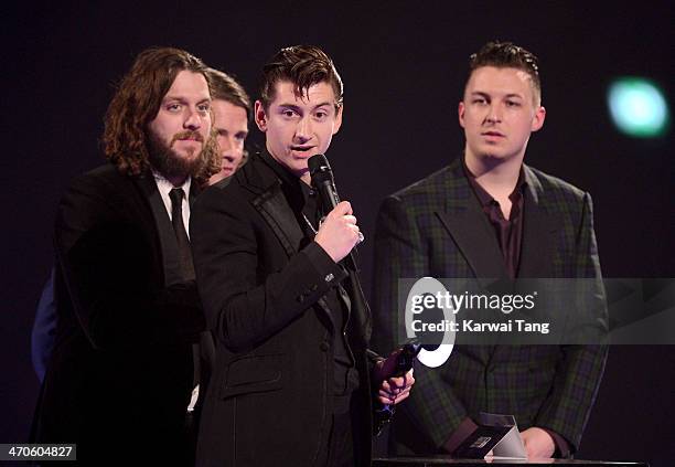 Alex Turner, Nick O'Malley, Jaime Cook and Matt Helders of Arctic Monkeys receive the award for the MasterCard British Album of the Year at The BRIT...