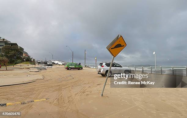 Sand washes up on to the Cronulla Esplanade on April 22, 2015 in Sydney, Australia. Three people have died and more than 200,000 are still without...