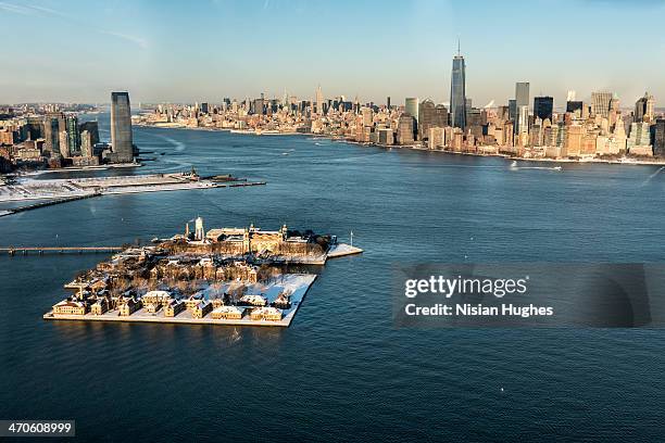 aerial of ellis island, lower manhattan under snow - ellis island stock pictures, royalty-free photos & images