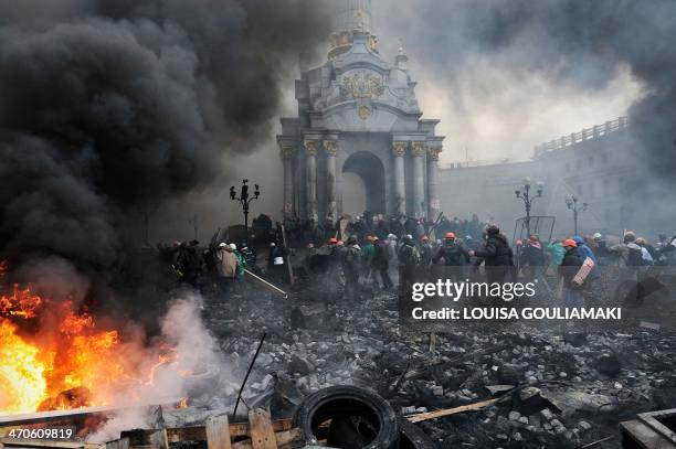 Protesters advance towards new positions in Kiev on February 20, 2014. Armed protesters stormed police barricades in Kiev on Thursday in renewed...