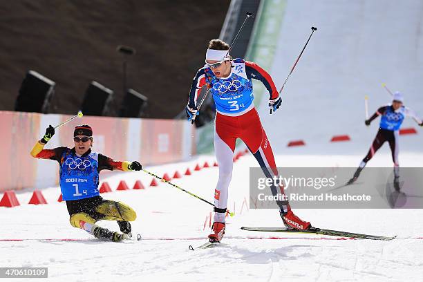 Joergen Graabak of Norway narrowly beats Fabian Riessle of Germany in the Nordic Combined Men's Team 4 x 5 km during day 13 of the Sochi 2014 Winter...