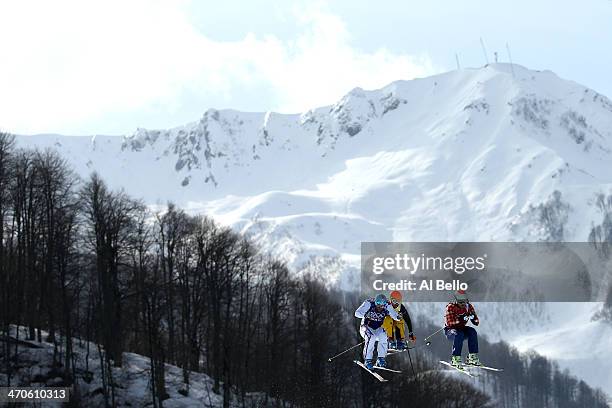 Brady Leman of Canada leads from Florian Eigler of Germany and Arnaud Bovolenta of France during the Freestyle Skiing Men's Ski Cross Semi Finals on...