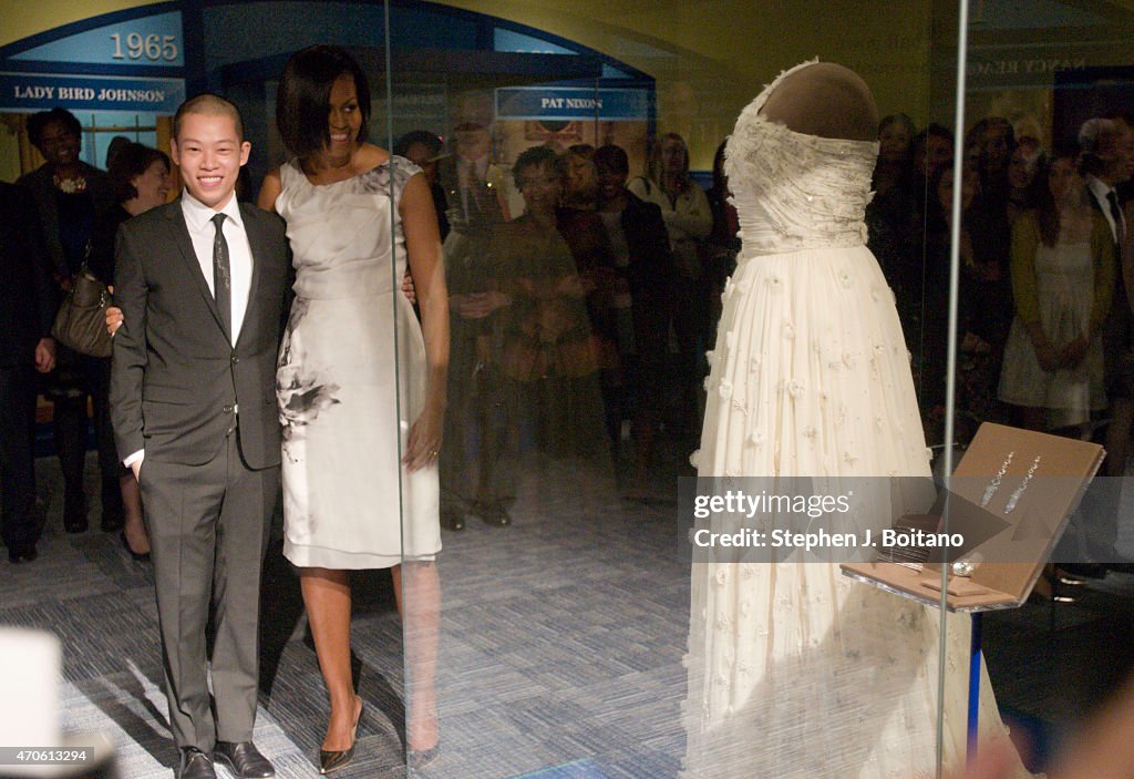 Michelle Obama shows designer Jason Wu the inaugural gown she wore to ...