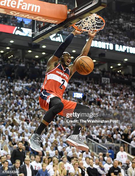 Washington Wizards guard John Wall dunks during their first half run against the Toronto Raptors during game two action on April 21, 2015 in Toronto,...