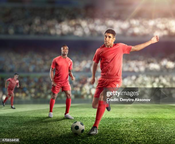 soccer player kicking ball in stadium - football player illustration stock pictures, royalty-free photos & images