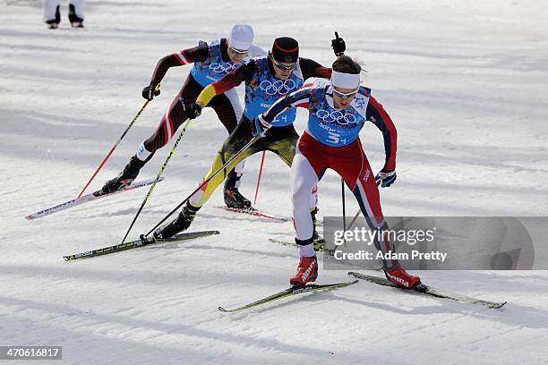 Mario Stecher of Austria, Fabian Riessle of Germany and Joergen Graabak of Norway compete in the Nordic Combined Men's Team 4 x 5 km during day 13 of...