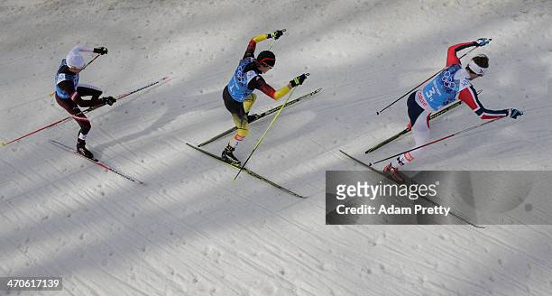 Mario Stecher of Austria, Fabian Riessle of Germany and Joergen Graabak of Norway compete in the Nordic Combined Men's Team 4 x 5 km during day 13 of...
