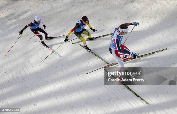 Mario Stecher of Austria, Fabian Riessle of Germany and Joergen Graabak of Norway compete in the Nordic Combined Men's Team 4 x 5 km during day 13 of...