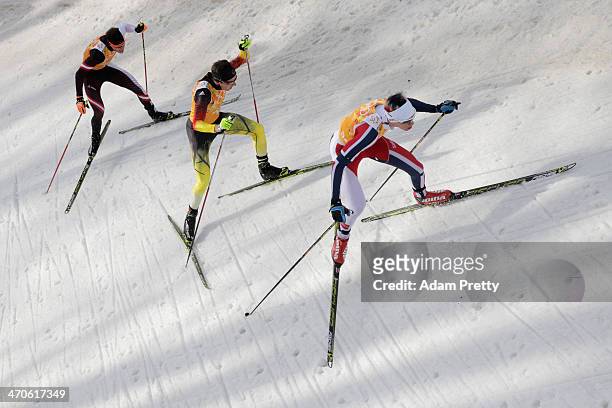 Bernhard Gruber of Austria, Johannes Rydzek of Germany and Magnus Krog of Norway compete in the Nordic Combined Men's Team 4 x 5 km during day 13 of...