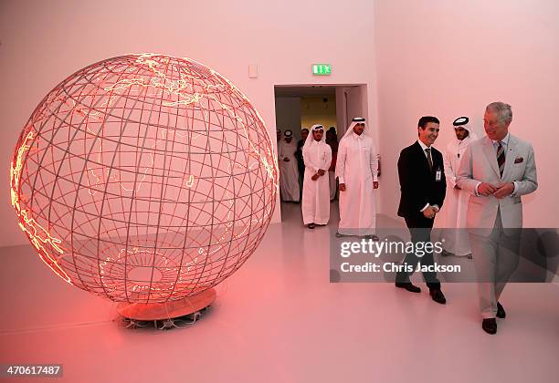 Prince Charles, Prince of Wales tours an exhibition of modern art with Sheikha Al Mayassa at Mathaf on February 20, 2014 in Doha, Qatar. The Prince...