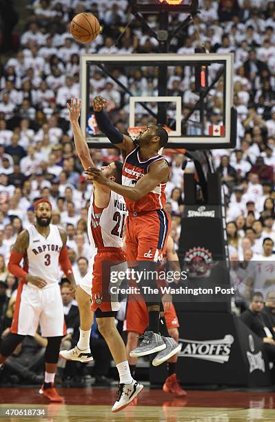 Washington Wizards guard John Wall steals the ball from Toronto Raptors guard Greivis Vasquez during game two action on April 21, 2015 in Toronto,...