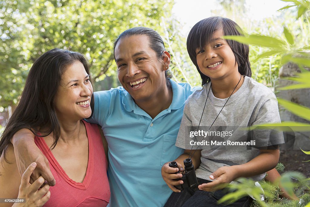 Family smiling outdoors