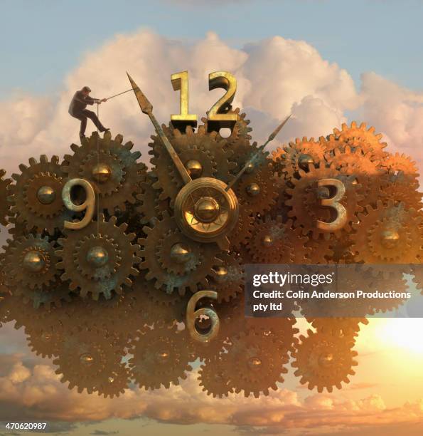 caucasian man pulling clock hands - digital era stock-fotos und bilder