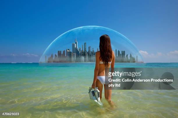 asian woman admiring city in tropical water - biosphere planet earth bildbanksfoton och bilder