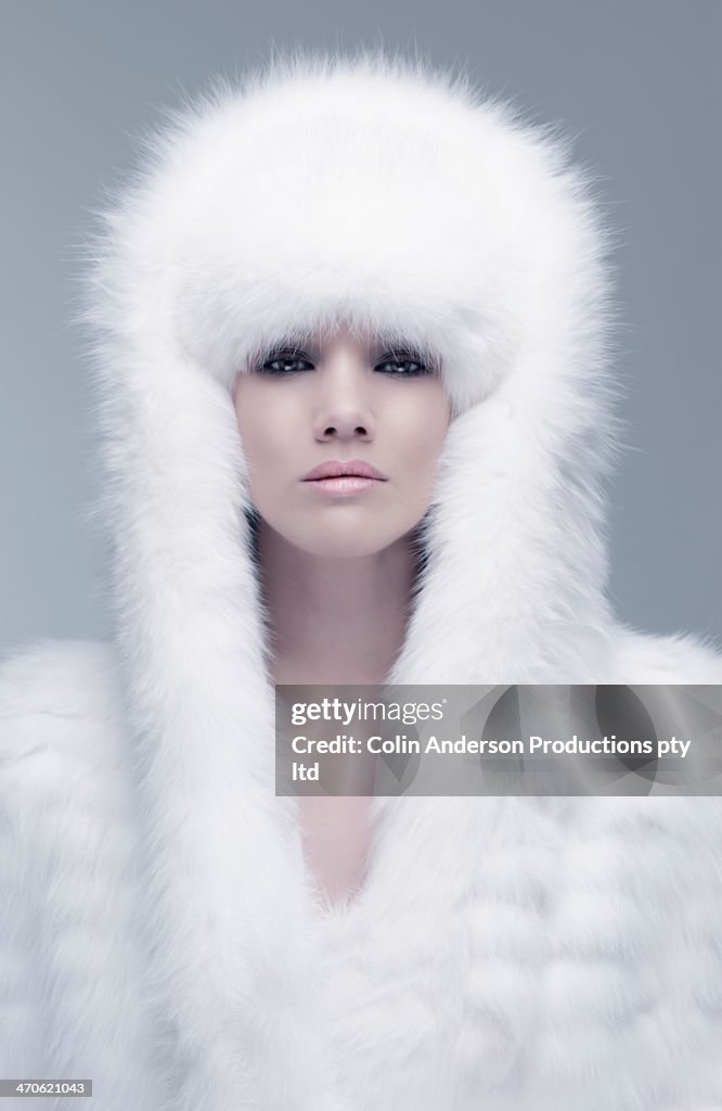 Pacific Islander woman wearing fur hood