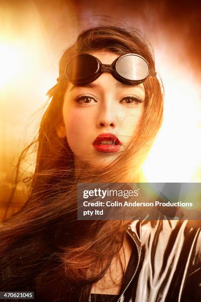mixed race woman wearing goggles - back lit stock pictures, royalty-free photos & images