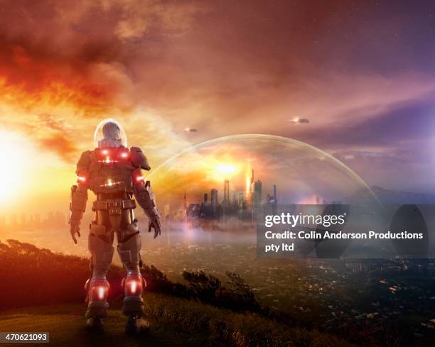 caucasian soldier wearing glowing armor - future space stockfoto's en -beelden