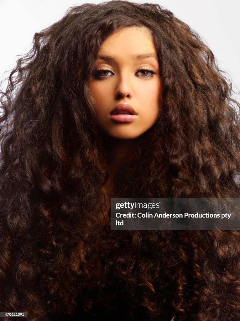 Mixed race woman with thick curly hair