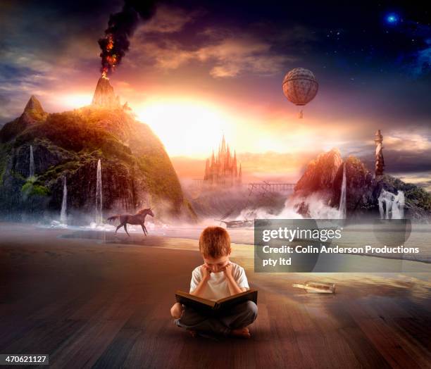 italian boy imagining contents of book - imaginación fotografías e imágenes de stock