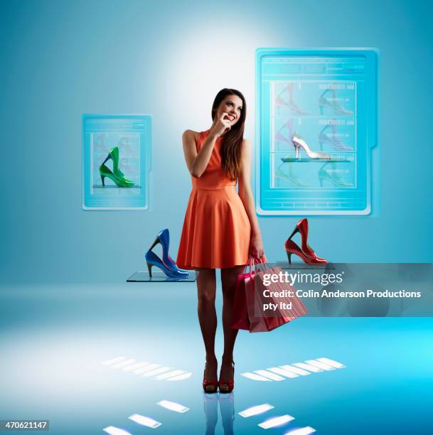 caucasian woman shopping for shoes online - shopping bag stock photos et images de collection