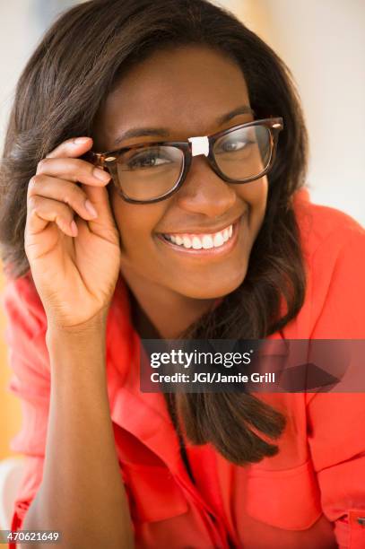 black woman wearing taped glasses - interim stock pictures, royalty-free photos & images