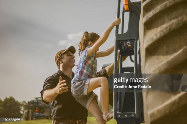 caucasian father and daughter working on farm - missouri farm stock pictures, royalty-free photos & images
