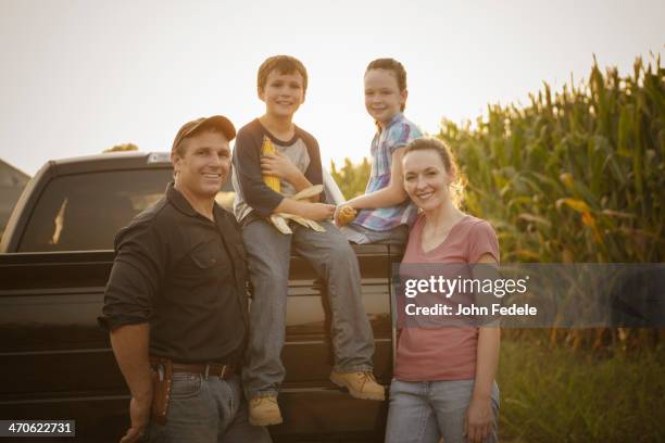 caucasian family smiling on truck - farm truck stock pictures, royalty-free photos & images