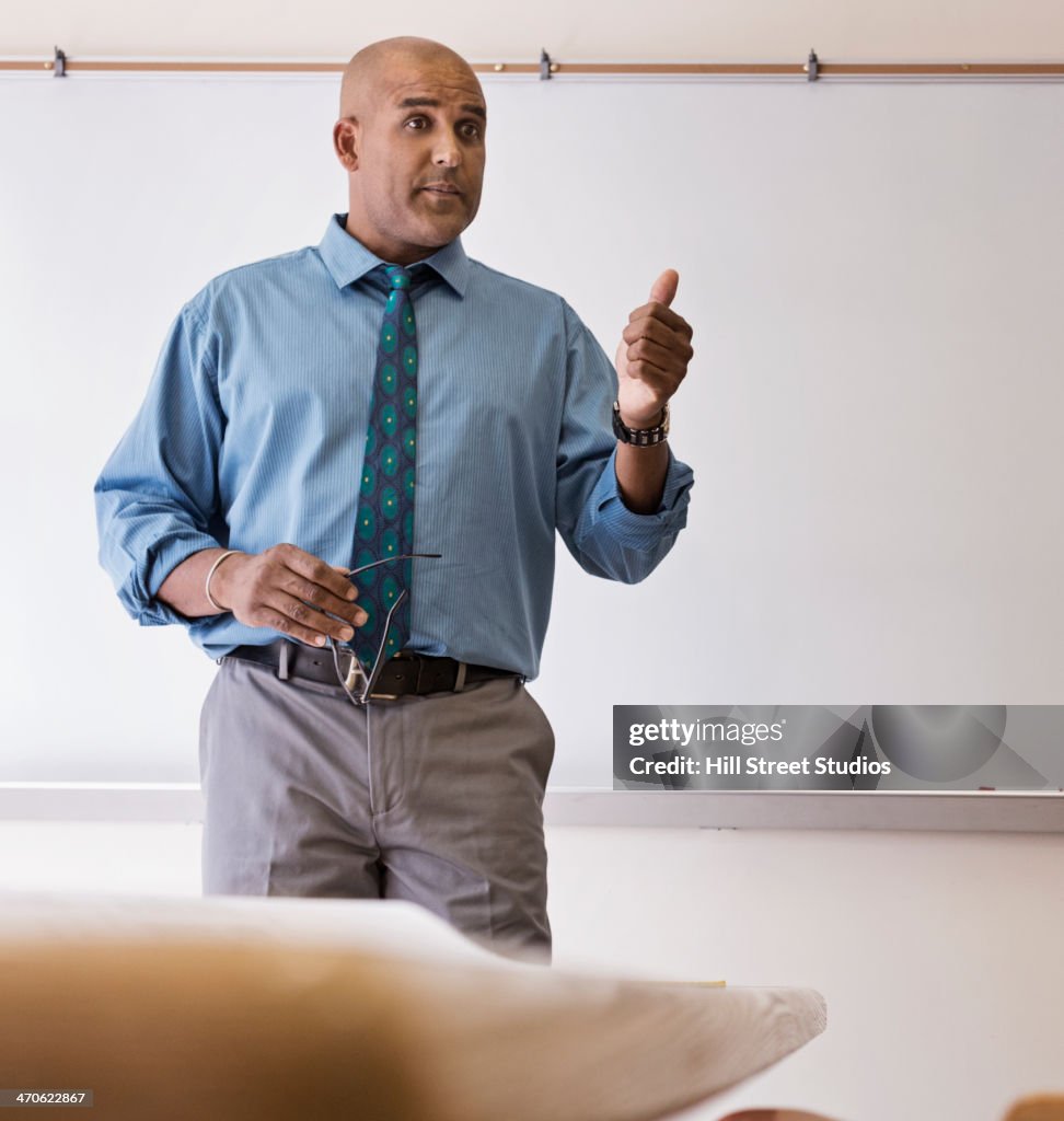 Businessman giving speech in meeting