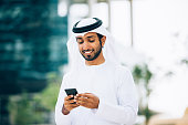 Emirati using a smart phone