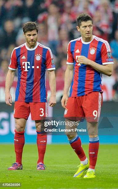 Xabi Alonso and Robert Lewandowski of Munich look on during the UEFA Champions League quarter final second leg match between FC Bayern Muenchen and...