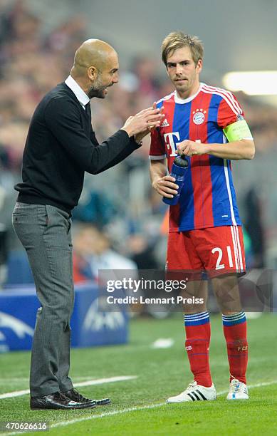 Josep Guardiola , head coach of Munich talks to Philipp Lahm during the UEFA Champions League quarter final second leg match between FC Bayern...