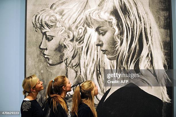 Alice Dallagio , daughter of Picasso's model Sylvette David, later Lydia Corbett,, and her daughters Ella and Josie pose in front of a photograph of...