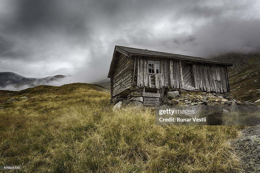 Worn old Norwegian wooden cabin.