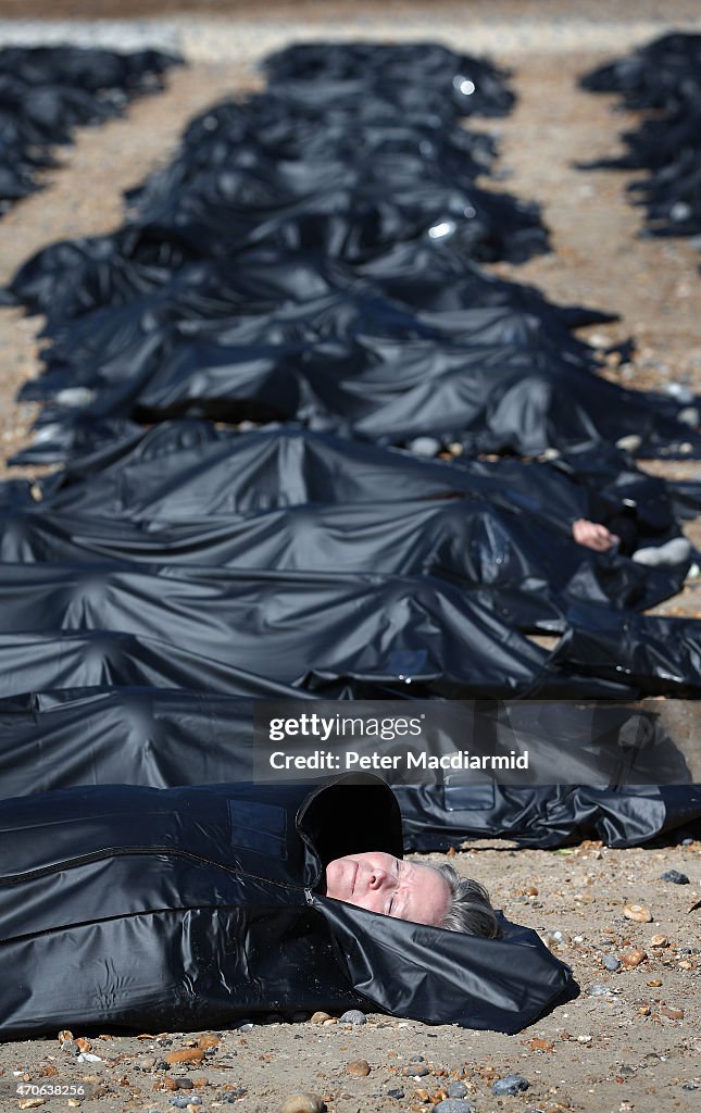 Charity Place Body Bags On Brighton Beach To Highlight Migrant Drowning Crisis