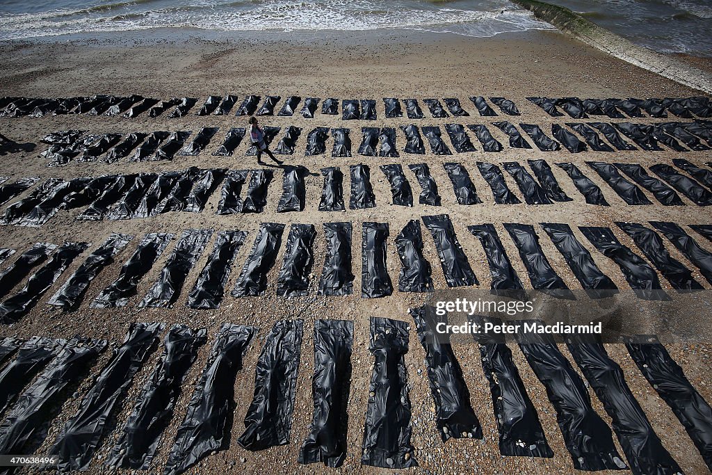 Charity Place Body Bags On Brighton Beach To Highlight Migrant Drowning Crisis