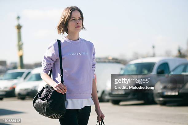 Model Alexandra Hochguertel exits the Carven show in a Carven sweater and Alexander Wang bag at the Tuileries on Day 3 of Paris Fashion Week FW15 on...