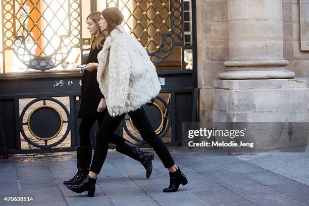 Models Yulia Musieichuck and Ella Zadavysvichka and exit the Ann Demeulemeester show at Couvent des Cordeliers on Day 3 of Paris Fashion Week FW15 on...