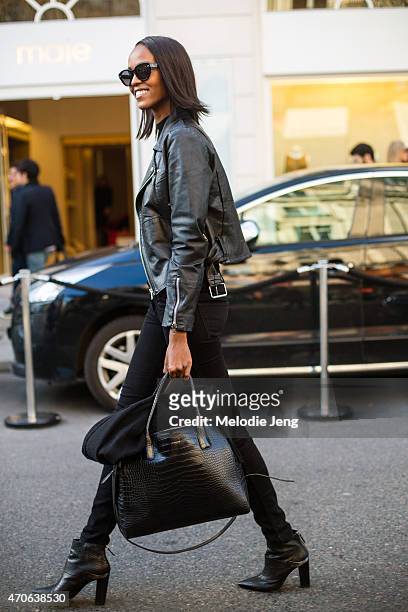 Model Leila Nda exits the Balmain show with a Le Tanneur bag at the Grand Hotel on Day 3 of Paris Fashion Week FW15 on March 5, 2015 in Paris, France.