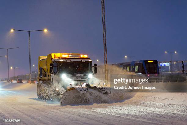 snow plough at dusk - quitanieves fotografías e imágenes de stock