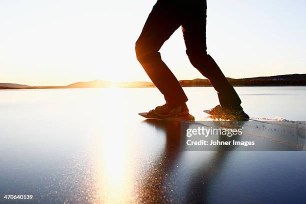 woman long-distance skating, low section - hockey skate stock pictures, royalty-free photos & images