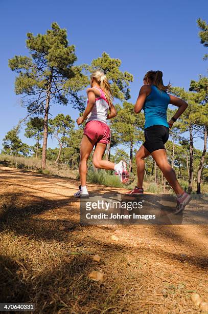 two women running - johner images bildbanksfoton och bilder