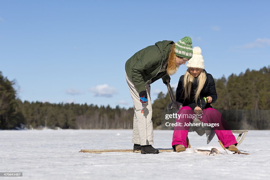 Women fishing at winter